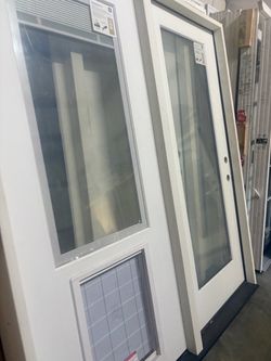 72 in Patio door with a pet Guard and built in blinds