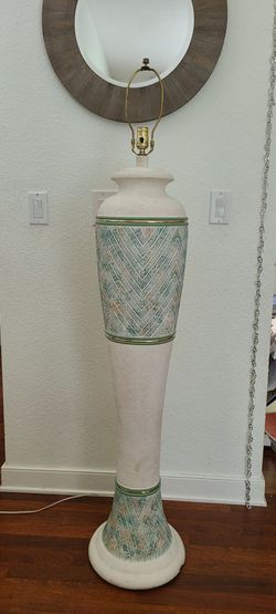 vintage plaster floor lamp features a textured, white finish with green and orange geometric chevron patterns
