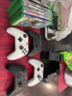 4 X Box One Paddles, 2 chargers and 6 games