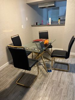 Glass dinner table and 4 chairs