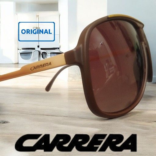Carrera 173/N/S 0807/HA navigator sunglasses with a black plastic frame and brown gradient lenses.