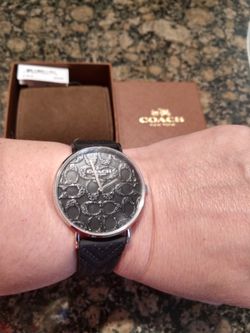Black water resistant Coach women's watch