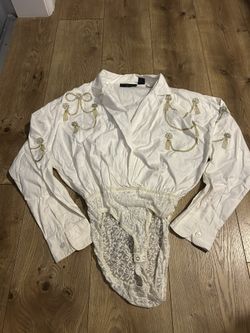 vintage 1980s or 1990s white button-down bodysuit romper featuring gold embroidery. Media 