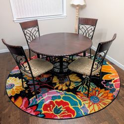 Dining Table with Four Chairs and Rug