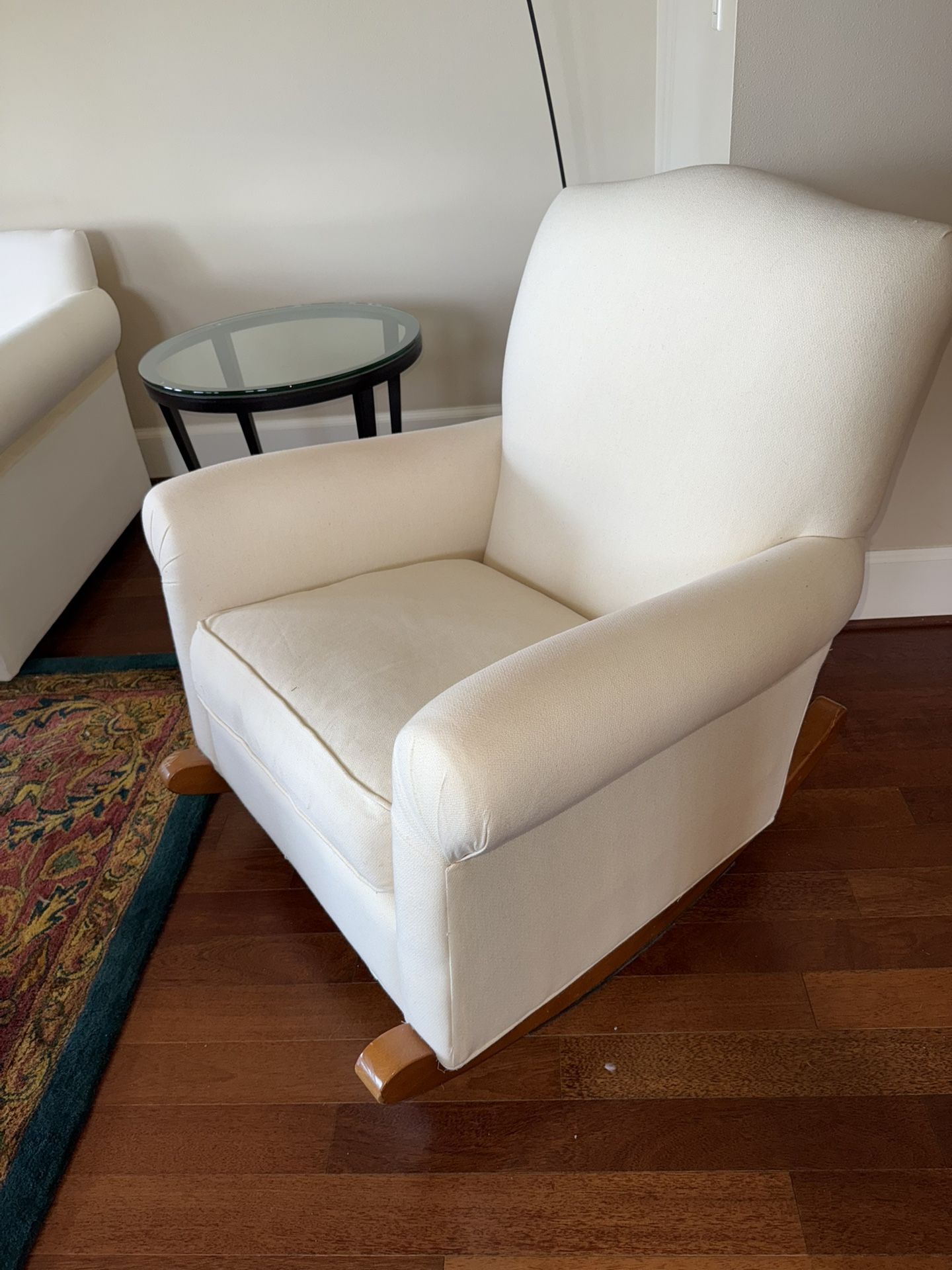 Two upholstered rocking chairs, plus ottoman.
