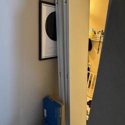 Two pairs of white bi-fold closet doors