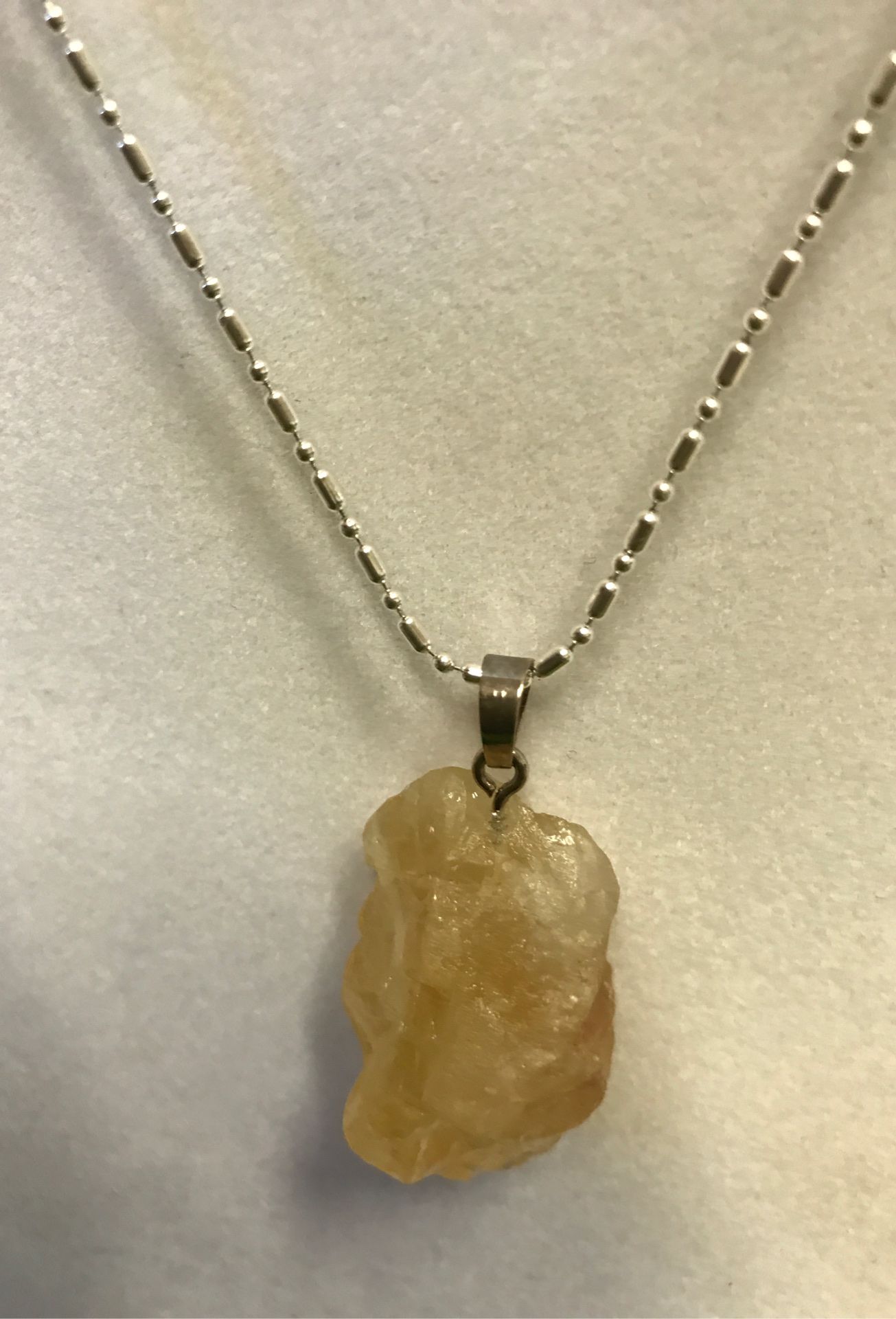 Citrine raw stone pendant with sterling silver chain. 18 inches in length