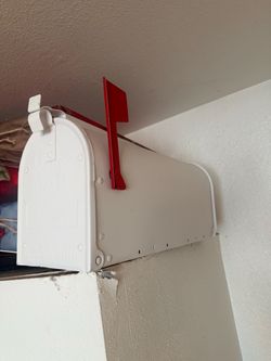White Metal Mailbox with Red Flag