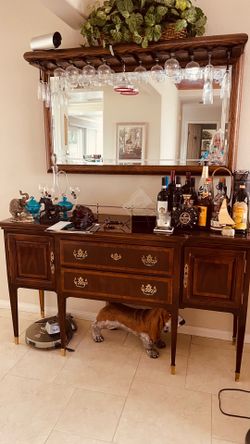 Dark wood wine cabinet with mirror