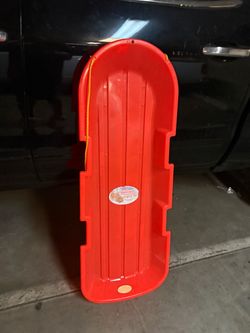 Red Plastic Snow Toboggan Sled