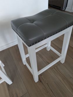Three 24" saddle stools white and grey
