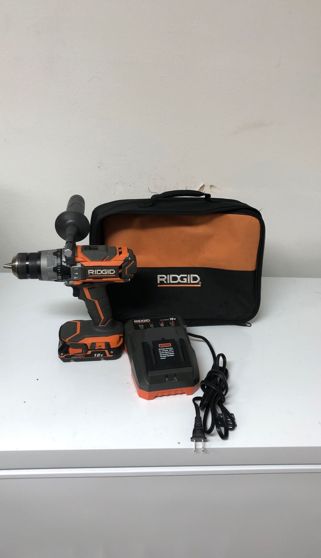 RIDGID 18-Volt Lithium-Ion Cordless Brushless 1/2 in. Compact Hammer Drill Kit with one 2.0 Ah Battery, Charger, and Bag