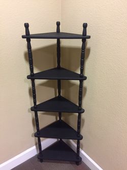 Like new 5 tier corner shelving unit.