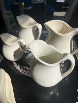 Old cream pitchers