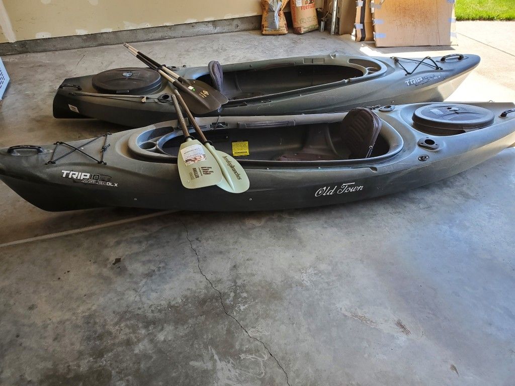Old Town Trip 10 Angler DLX kayaks with paddles