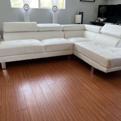 New Reclining Sectional W Adjustable Headrests .  White Leather .  106” X 77”.  Free Delivery !