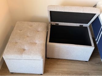 2 gray upholstered storage ottomans