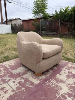 Contemporary CB2 “Bacio” Camel Bouclé Lounge Chair by Ross Cassidy.