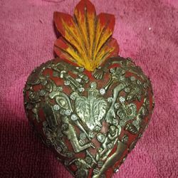 Hand Crafted Mexican Folk Art Heart Typically Made Of Wood And Decorated With Small Medal Charms For Sale.