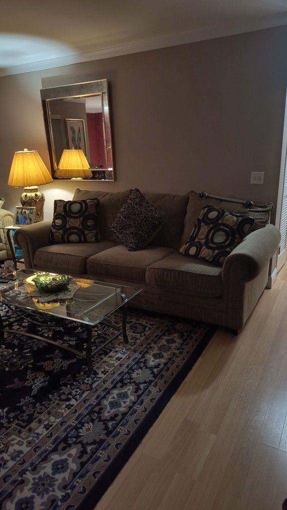 Family Room . Couch , Love Seat, Glass Tables