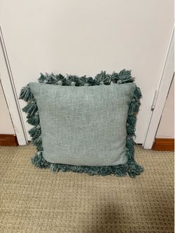 Two green pillows with washable covers