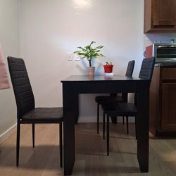 Black table 4 chairs