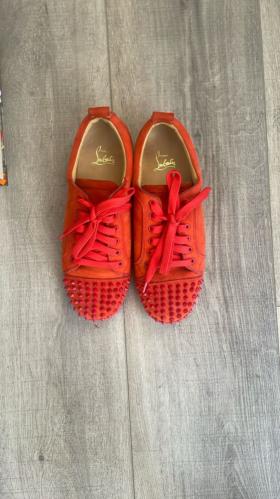 red suede christian louboutin spike shoes