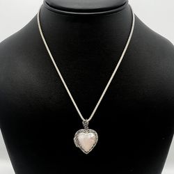 This gorgeous silver necklace made of 925 sterling silver. Total weight is 10.8 grams. Chain is 16 inch long. Pendant is in a good shape. What you see
