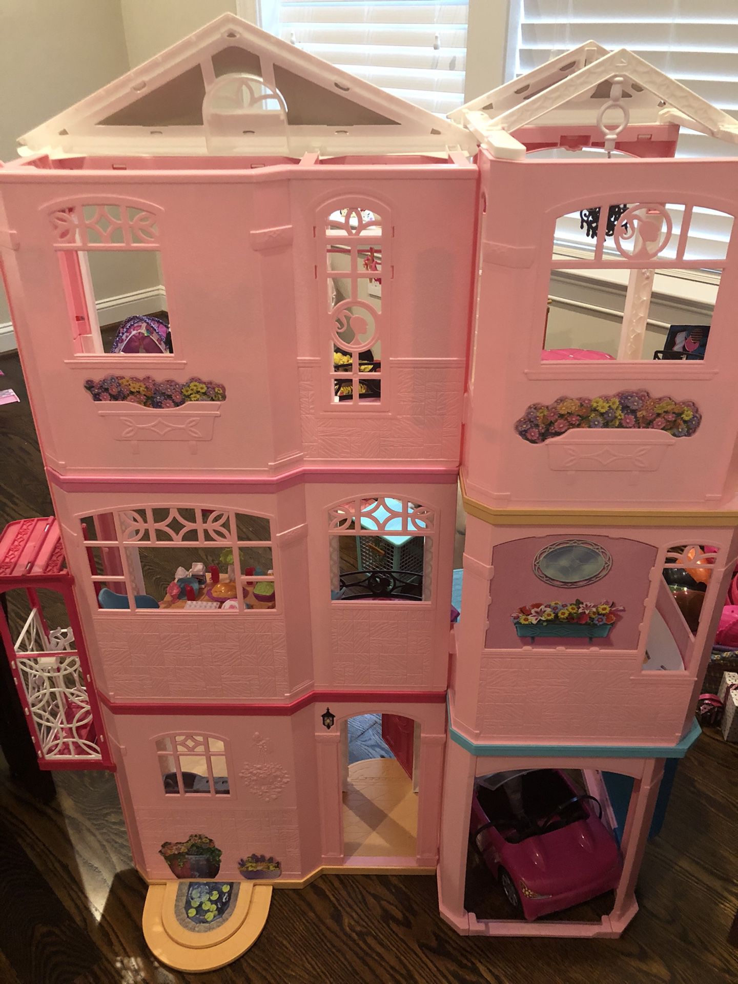 Barbie dream house with furnishings and car