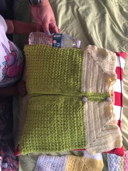 Handmade baby crochet vest or sweater the green with yellow is 2 to 3 years we have 1-2-3 months old asking for $6 each
