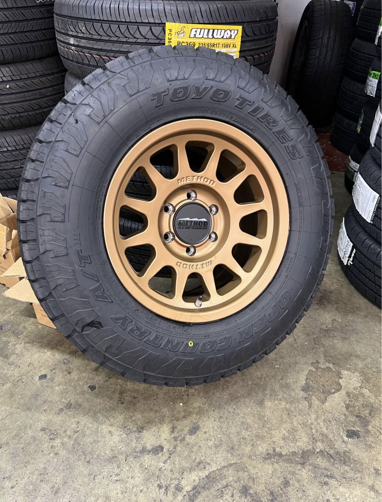 Method MR703 Bronze Wheels 265/70R17 Toyo Open Country ATIll Tires Package Deal, WE FINANCE