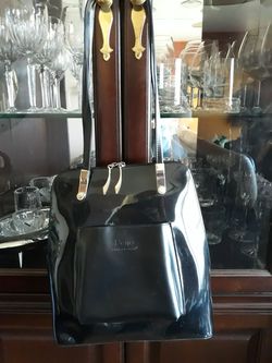 BEIJO. Black faux convertible Purse or Backpack.Was never use but have some scratches.