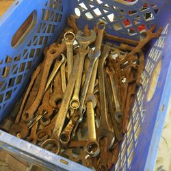 Milk crate full of wrenches wood drill bit