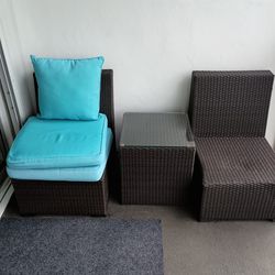 2 Chairs and Table.  Couch (Seats 2) and Glass table. Also Includes all cushions (blue) and Beige Extra Cushion covers