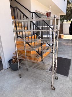 Metal shelf with wheels