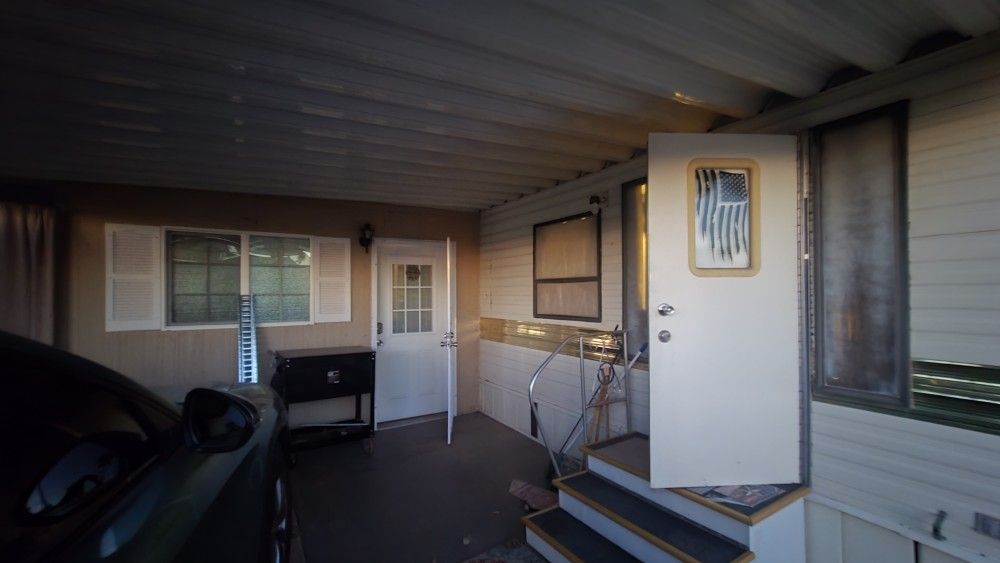 1987 Cricket Park Model with 15x22 fully enclosed Arizona room. $2,500as is