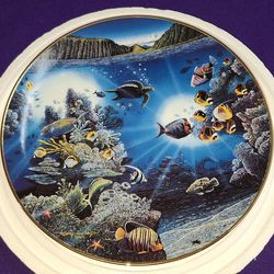 Danbury Mint collector plate titled "Serenity of Waipio" by artist Robert Lyn Nelson, part of the "Underwater Paradise" series from 1991. J5L033