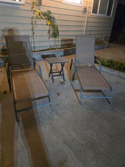 Two reclining lounge chairs good condition no tears