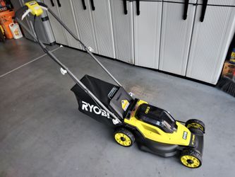 Ryobi One+18 volt battery. 13 in lawn mower. With battery and charger. New in the box.