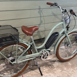 Electra 5i townie go with hydraulic disc brakes and bosch mid drive rear rack with removable basket,color matched fenders, front and rear lights, cafe