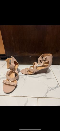  Title: XOXO Women’s Nude Wedge Sandals - Size 7 US  Description: A pair of stylish nude wedge sandals by XOXO, designed with intricate laser-cut stra