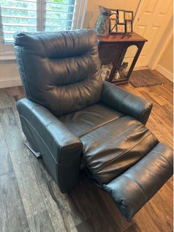Grey leather recliner.