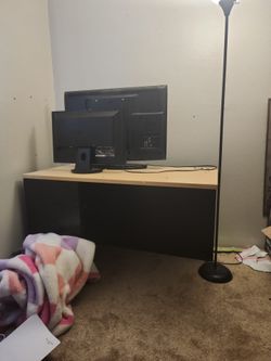 Desk and monitor and tv