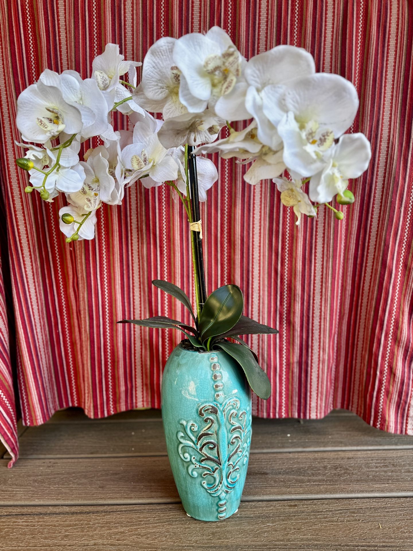 White orchids arrangement In a Vintage Ceramic Pot