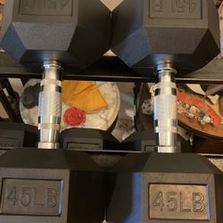 PAIR  OF  45  LB.  RUBBER  HEX  DUMBBELLS   •  RUBBER  95s 90s 80z 70z 60s 50s 40s 35s 30s 25s 20s 15s 10s  Also Available+ KETTLEBELLS + PLATES + BAR