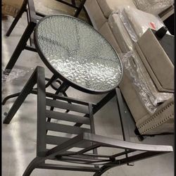 2 metal chairs with table