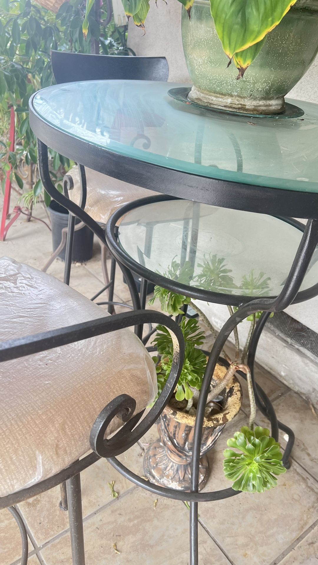 Two High swing Chair And Glass Table