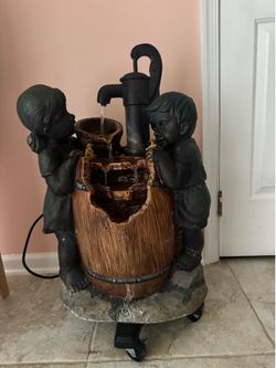 Boy and girl water fountain
