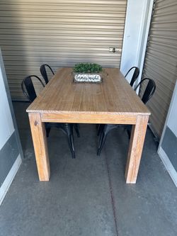 Heavy solid wood table and 4 metal chairs