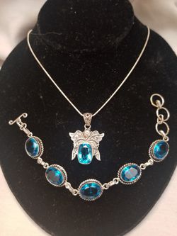 Beautiful solid 925 silver necklace and bracelet set with London blue topaz in them.